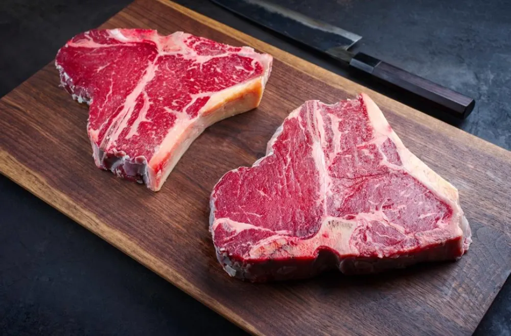 Dry Ageing at Woodhouse Butchery | Steaks on a wooden board.