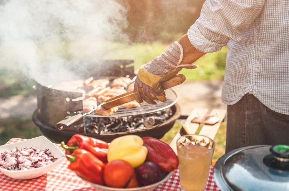 BBQ | Person grilling on a BBQ.